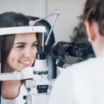 Seems like good results. Optometrist checking vision of young beautiful woman