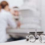 Selective focus of eye test spectacles lying on the table